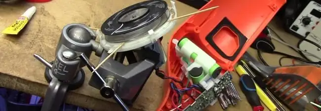 Vacuum cleaner repair parts and tools on a workbench in Colorado Springs, CO